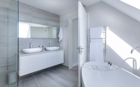 Modern barrier-free bathroom with accessible features like a walk-in shower, grab bars, and a sleek, spacious layout.